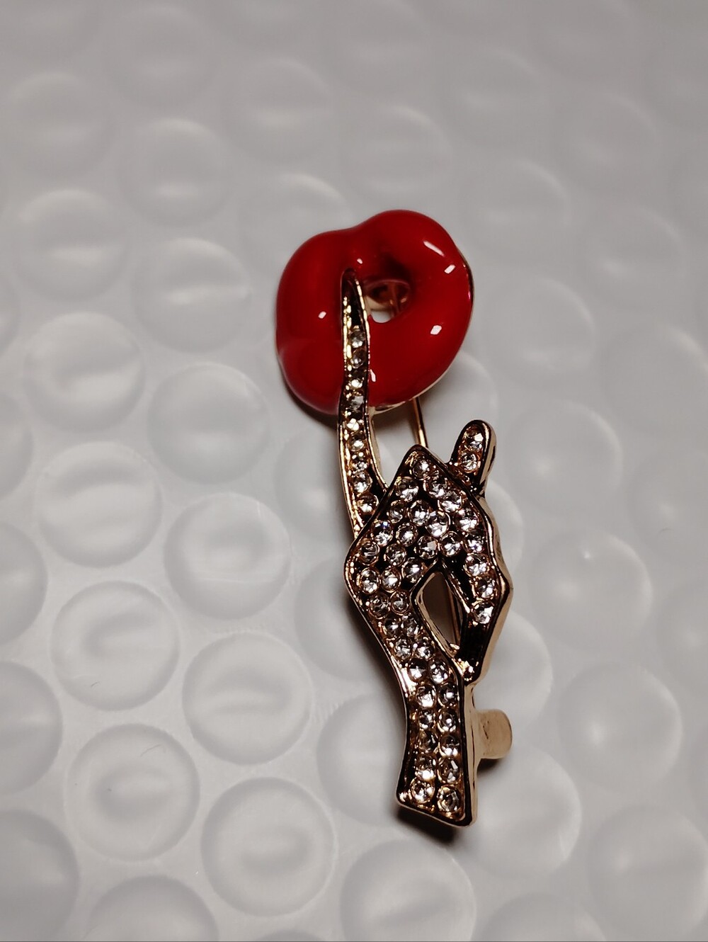 Crystal-Embellished Gold-Tone Hand Brooch with Red Lip Accent